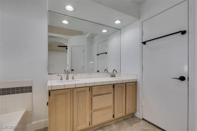 87 Ginger Lily Ter, Henderson, NV 89074 - bathroom with double vanity, a bath, and recessed lighting