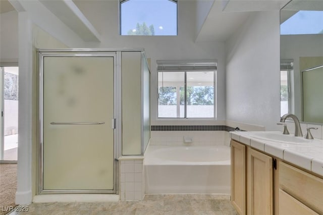 87 Ginger Lily Ter, Henderson, NV 89074 - bathroom with a stall shower, a garden tub, and vanity