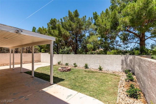 87 Ginger Lily Ter, Henderson, NV 89074 - fenced backyard featuring an outdoor fire pit and a patio
