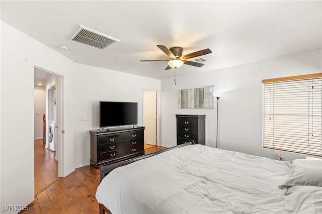 10253 Martinsburg Ct, Las Vegas, NV 89183 - bedroom featuring hardwood / wood-style floors, ceiling fan, and separate washer and dryer