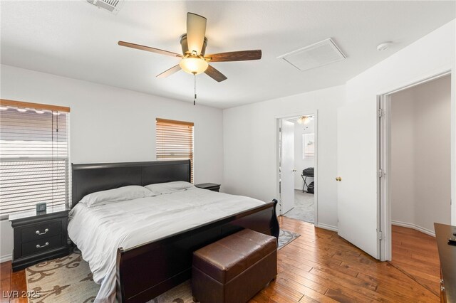 10253 Martinsburg Ct, Las Vegas, NV 89183 - bedroom with wood-type flooring, a ceiling fan, and attic access