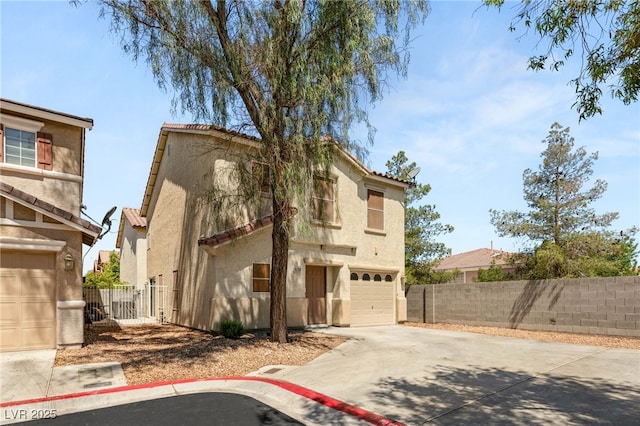 10253 Martinsburg Ct, Las Vegas, NV 89183 - view of front of property with driveway, an attached garage, stucco siding, and a tile roof