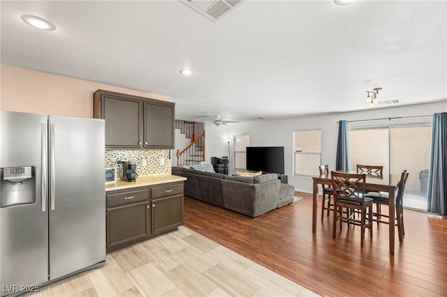 10253 Martinsburg Ct, Las Vegas, NV 89183 - kitchen featuring stainless steel fridge, decorative backsplash, ceiling fan, recessed lighting, and light countertops