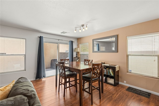 10253 Martinsburg Ct, Las Vegas, NV 89183 - dining area featuring wood finished floors and baseboards