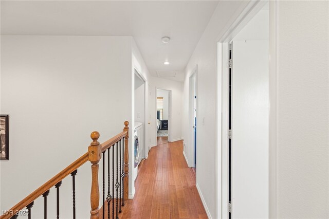 10253 Martinsburg Ct, Las Vegas, NV 89183 - corridor with light wood-style flooring, an upstairs landing, and recessed lighting