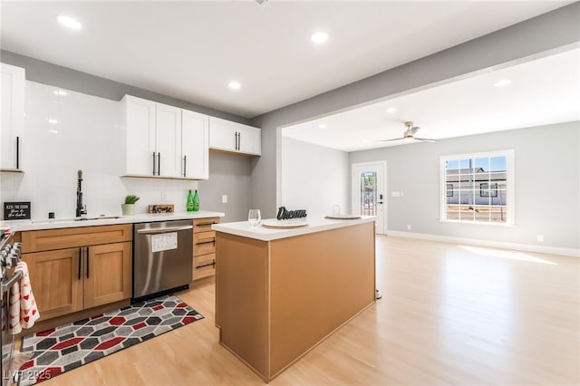 915 Melrose Dr, Las Vegas, NV 89101 - kitchen featuring dishwasher, light wood-style flooring, light countertops, tasteful backsplash, and recessed lighting