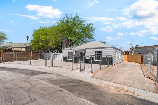 915 Melrose Dr, Las Vegas, NV 89101 - view of front of home with a fenced front yard, a chimney, and driveway