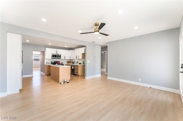 915 Melrose Dr, Las Vegas, NV 89101 - unfurnished living room with ceiling fan, light wood finished floors, and recessed lighting