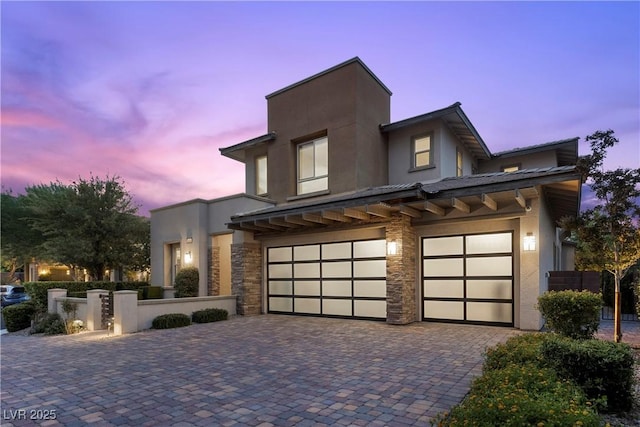 6338 Skystone St, Las Vegas, NV 89135 - view of front of house with stucco siding, a garage, and decorative driveway