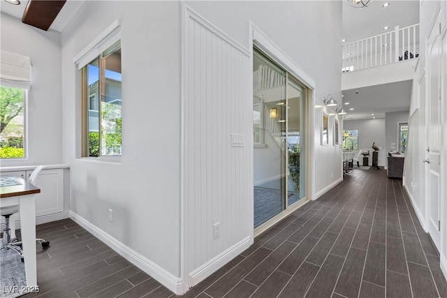 6338 Skystone St, Las Vegas, NV 89135 - hallway with dark wood-type flooring and healthy amount of natural light