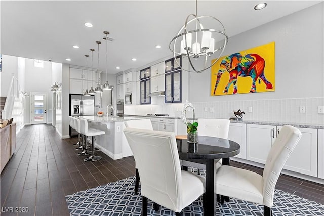 6338 Skystone St, Las Vegas, NV 89135 - dining space with recessed lighting, dark wood-style floors, and a chandelier