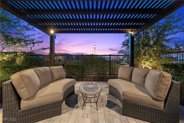 6338 Skystone St, Las Vegas, NV 89135 - patio terrace at dusk with outdoor lounge area, a pergola, and a patio area