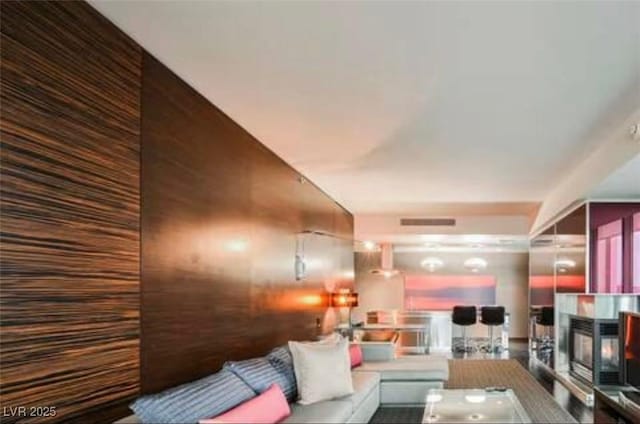 4381 W Flamingo Rd Unit 2902, Las Vegas, NV 89103 - living area featuring a multi sided fireplace