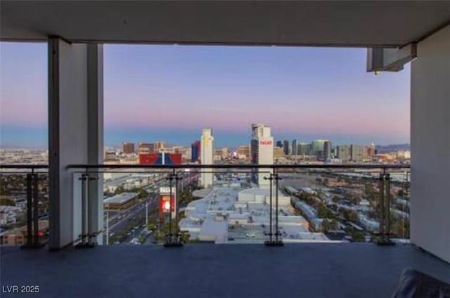 4381 W Flamingo Rd Unit 2902, Las Vegas, NV 89103 - balcony at dusk featuring a city view