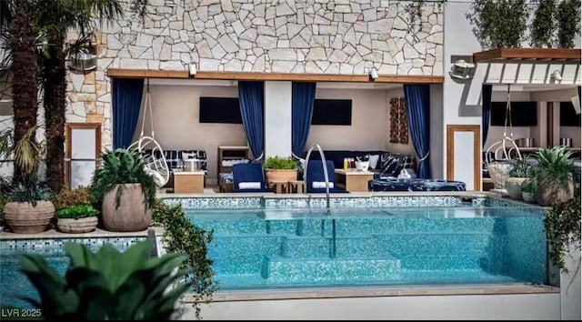 4381 W Flamingo Rd Unit 2902, Las Vegas, NV 89103 - back of house featuring stucco siding, stone siding, an outdoor pool, and outdoor lounge area