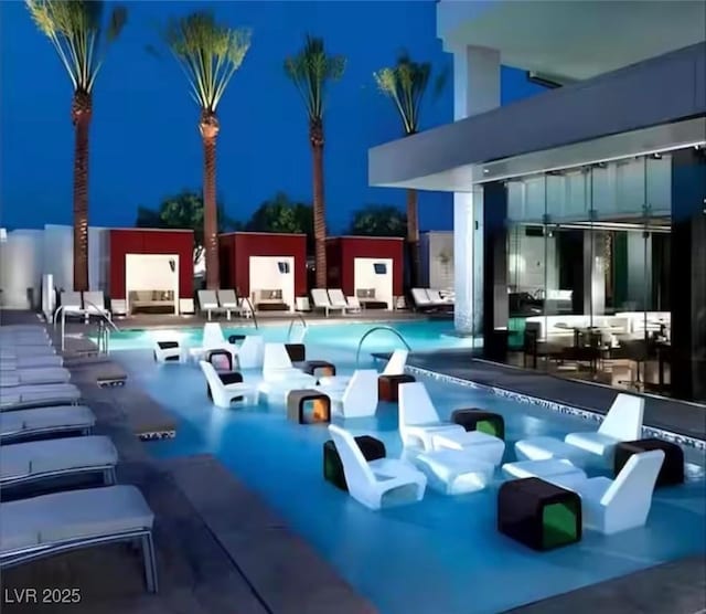 4381 W Flamingo Rd Unit 2902, Las Vegas, NV 89103 - community pool with a patio area