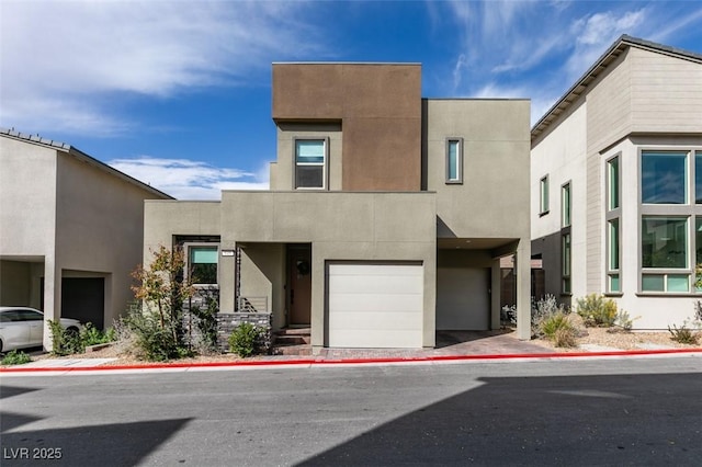 649 Tranquil Jade St, Las Vegas, NV 89138 - view of front of house featuring a garage and stucco siding
