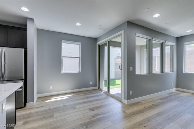 649 Tranquil Jade St, Las Vegas, NV 89138 - unfurnished dining area featuring light wood-type flooring and recessed lighting