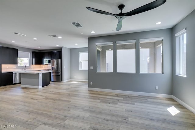 649 Tranquil Jade St, Las Vegas, NV 89138 - unfurnished living room with light wood-style flooring, a ceiling fan, and recessed lighting