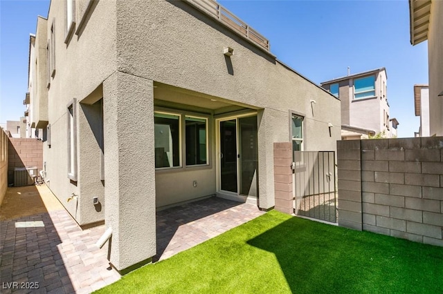649 Tranquil Jade St, Las Vegas, NV 89138 - rear view of house featuring a fenced backyard, a patio, stucco siding, and a gate