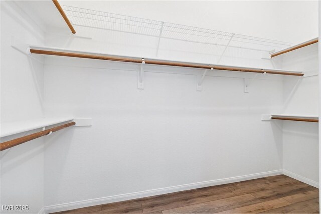 8113 Blue Cascade Ave, Las Vegas, NV 89128 - spacious closet with wood finished floors