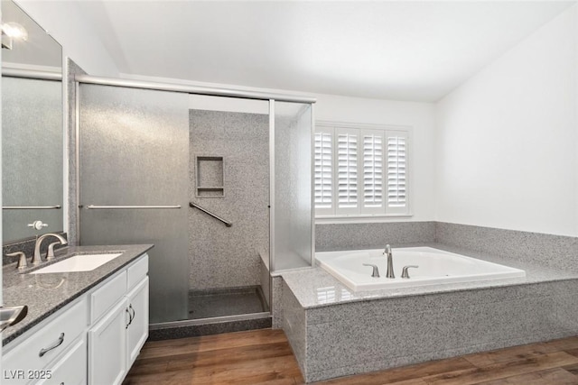 8113 Blue Cascade Ave, Las Vegas, NV 89128 - bathroom with a shower stall, wood finished floors, double vanity, and a bath