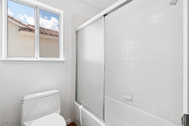 8113 Blue Cascade Ave, Las Vegas, NV 89128 - bathroom featuring toilet and combined bath / shower with glass door