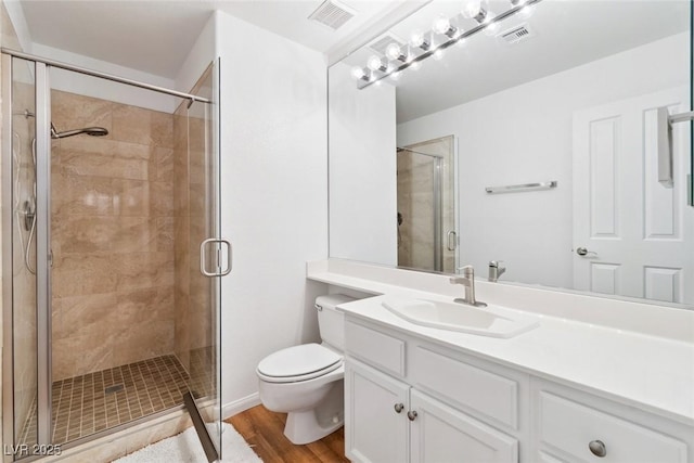8113 Blue Cascade Ave, Las Vegas, NV 89128 - bathroom featuring vanity, a shower stall, and wood finished floors
