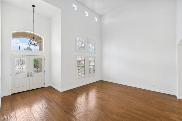 8113 Blue Cascade Ave, Las Vegas, NV 89128 - entrance foyer with a towering ceiling and dark wood finished floors
