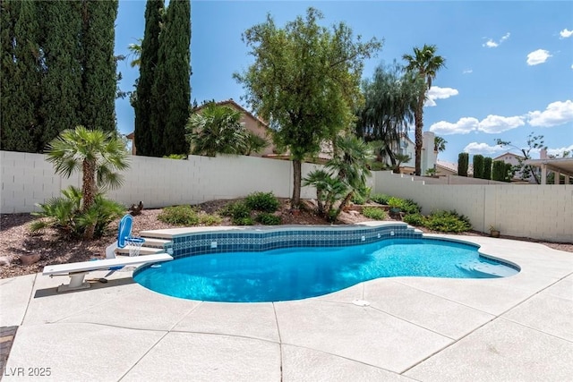 8113 Blue Cascade Ave, Las Vegas, NV 89128 - view of swimming pool with a patio, a fenced backyard, and a diving board