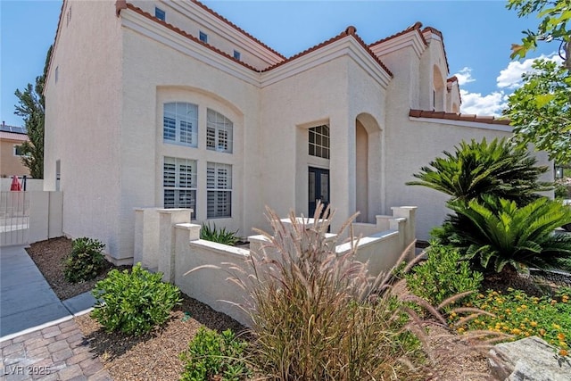 8113 Blue Cascade Ave, Las Vegas, NV 89128 - view of front of property with stucco siding, a tiled roof, and french doors