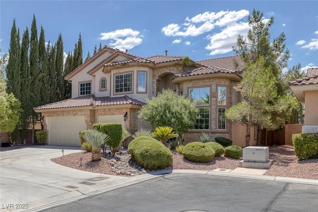 5405 San Bellasera Ct, Las Vegas, NV 89141 - mediterranean / spanish-style home with driveway, an attached garage, stone siding, a tile roof, and stucco siding