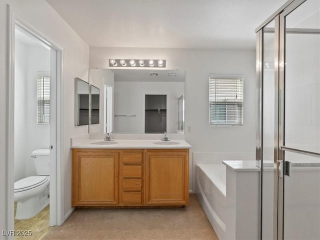 4905 Apache Valley Ave, Las Vegas, NV 89131 - bathroom with a garden tub, double vanity, plenty of natural light, and a shower stall