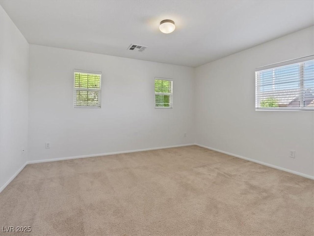 4905 Apache Valley Ave, Las Vegas, NV 89131 - empty room with healthy amount of natural light and light carpet