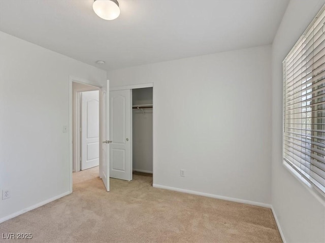 4905 Apache Valley Ave, Las Vegas, NV 89131 - unfurnished bedroom with multiple windows, light carpet, and a closet