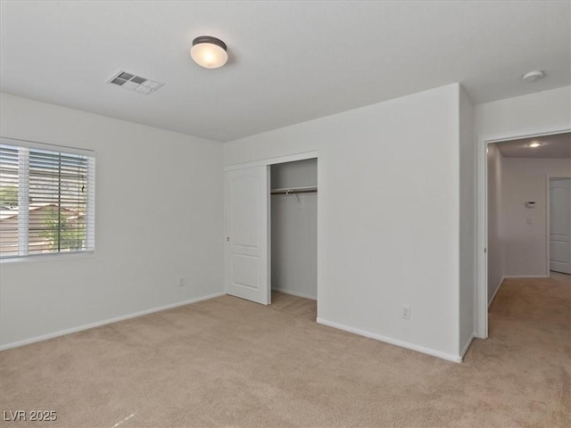 4905 Apache Valley Ave, Las Vegas, NV 89131 - unfurnished bedroom featuring light carpet and a closet