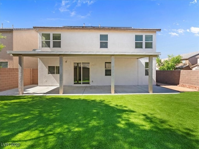 4905 Apache Valley Ave, Las Vegas, NV 89131 - back of property featuring a patio, stucco siding, and a fenced backyard