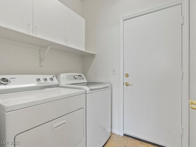 4905 Apache Valley Ave, Las Vegas, NV 89131 - laundry room with cabinet space, washer and dryer, and light tile patterned floors