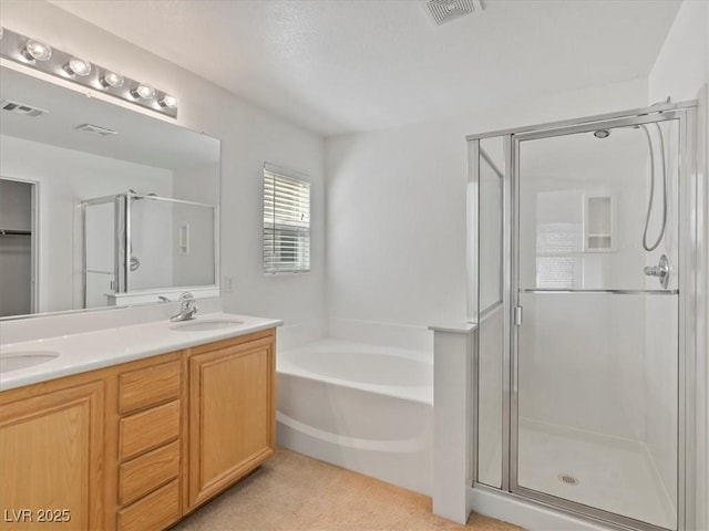 4905 Apache Valley Ave, Las Vegas, NV 89131 - bathroom with a shower stall, a bath, and double vanity
