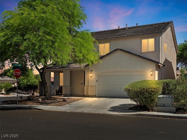 4905 Apache Valley Ave, Las Vegas, NV 89131 - traditional home with driveway, a garage, and stucco siding