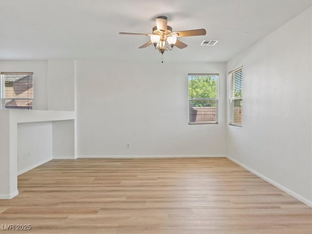 4905 Apache Valley Ave, Las Vegas, NV 89131 - spare room with a ceiling fan and light wood-style floors