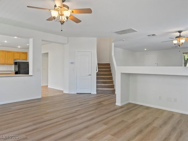 4905 Apache Valley Ave, Las Vegas, NV 89131 - unfurnished living room featuring a ceiling fan, recessed lighting, light wood-style floors, and stairway
