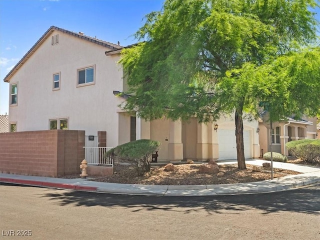 4905 Apache Valley Ave, Las Vegas, NV 89131 - view of front facade with stucco siding and a garage