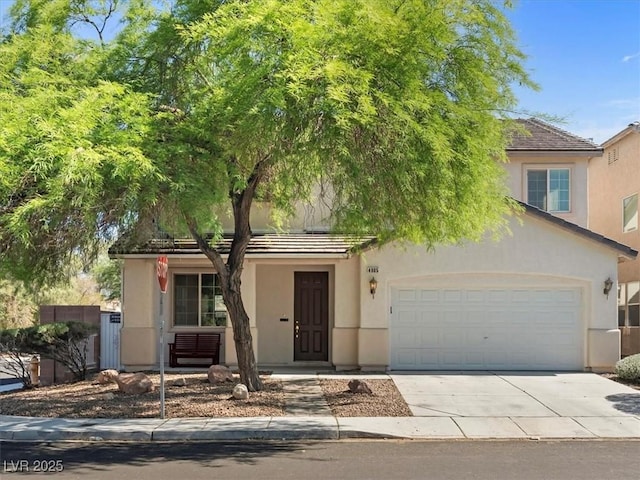 4905 Apache Valley Ave, Las Vegas, NV 89131 - obstructed view of property featuring concrete driveway, stucco siding, and a garage
