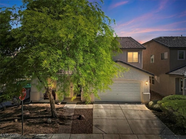 4905 Apache Valley Ave, Las Vegas, NV 89131 - view of front facade with concrete driveway, stucco siding, and an attached garage