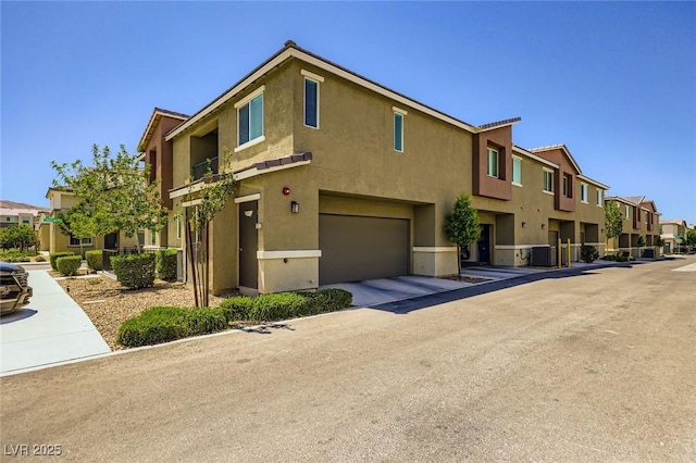 12282 Azure Gate Rd Unit 4, Las Vegas, NV 89183 - view of property with an attached garage and a residential view
