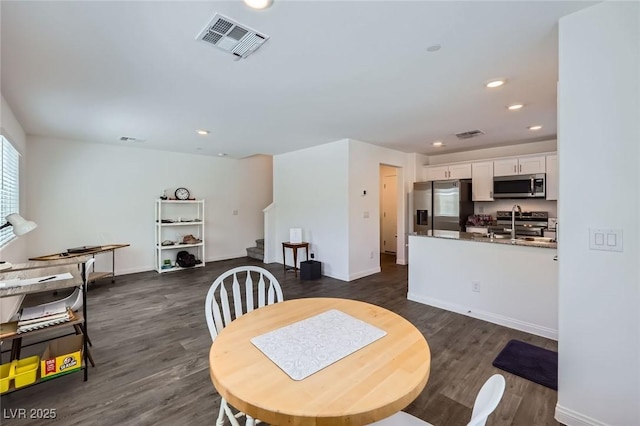 12282 Azure Gate Rd Unit 4, Las Vegas, NV 89183 - dining space featuring stairway, dark wood-style flooring, and recessed lighting