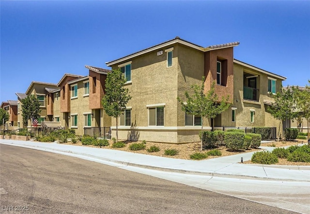 12282 Azure Gate Rd Unit 4, Las Vegas, NV 89183 - view of building exterior with a residential view