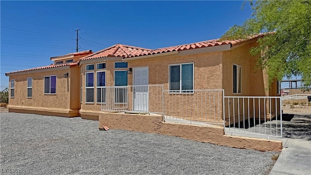 2530 Commercial Dr, Pahrump, NV 89048 - view of front facade featuring stucco siding and a tiled roof