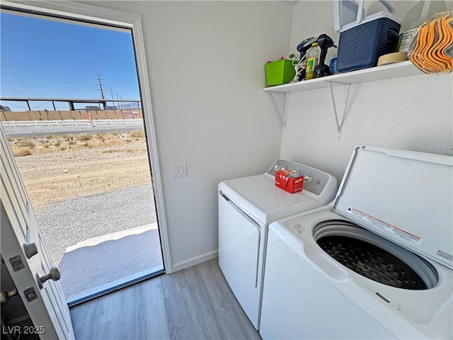 2530 Commercial Dr, Pahrump, NV 89048 - washroom with washer and dryer and wood finished floors